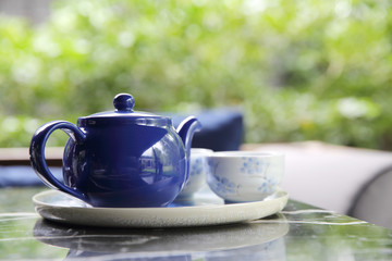 pouring tea into cup of tea in close up Chinese and Japan drink