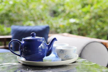 pouring tea into cup of tea in close up Chinese and Japan drink