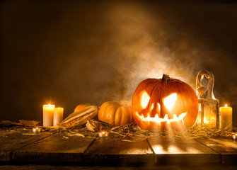 Scary halloween pumpkin on wooden planks