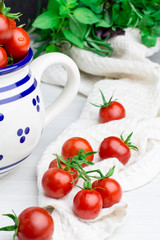 Cherry tomatoes in a barrel, soft focus, front view, vertical