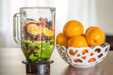 Healthy Mix of Fruits and Vegetables in a Mixer on the Table