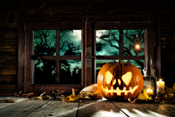 Fototapeta premium Scary halloween pumpkin on wooden planks