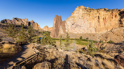The river is flowing among the rocks. Colorful Canyon. Amazing landscape of yellow sharp cliffs. Smith Rock state park, Oregon