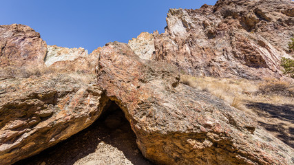 Unusual shaped rocks on the background of blue sky. Beautiful landscape of sharp cliffs. Smith Rock state park, Oregon