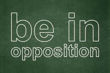 Obraz premium Politics concept: Be in Opposition on chalkboard background