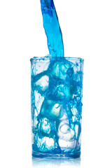 pouring blue water splash into glass isolated on white background with clipping path