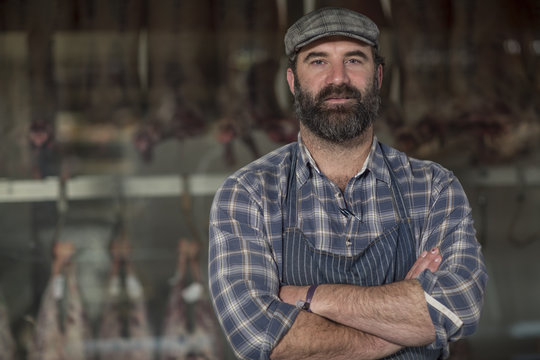 Portrait of confident butcher in butchery