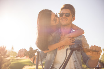 Friends cycling in park