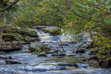 River and waterfalls with rocks and greenery. Norther Minnesota, secluded falls.
