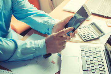 Business people are using smart phones.