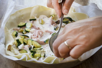 preparing quiche stuffed with vegetables
