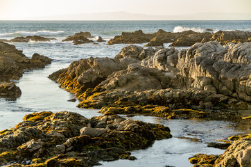 Fototapeta na wymiar Sunset on ocean rocks