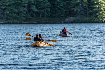 canoeists and kayakers on water