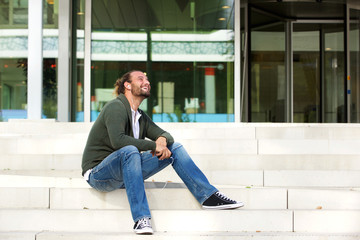 Man sitting on steps listening to music