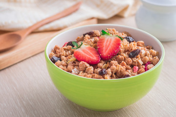 Muesli with strawberry in bowl for healthy breakfast