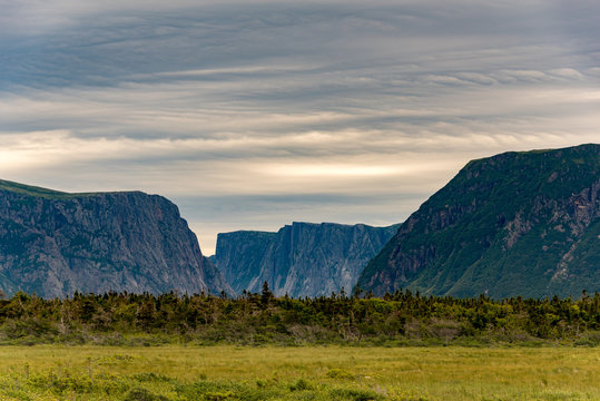 Western Brook Pond cliffs with foreboding sky