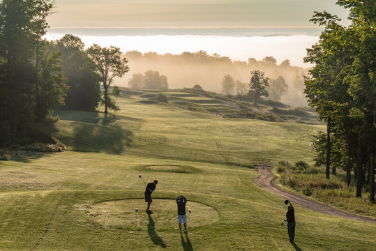 golfers on an early morning