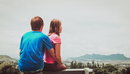 couple of travelers enjoying nature, city and sky