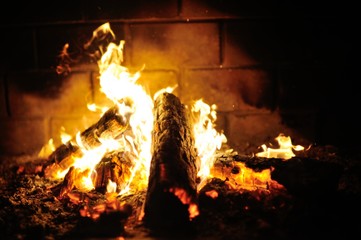 a cozy fire in the fireplace closeup