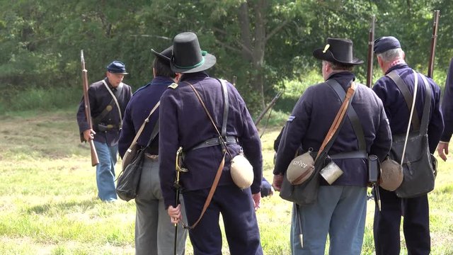 Civil War soldiers carrying injured