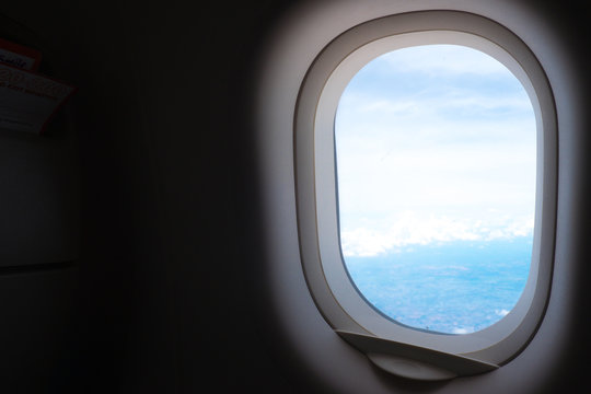 Plane Window View With Blue Sky