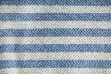 A full page of chunky blue and white striped knit background texture