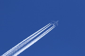 Airplane on the blue sky background