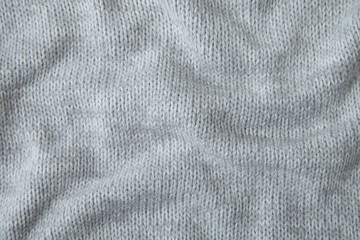 A full page of soft grey knitted sweater background texture