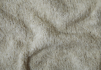 A full page of beige knit background texture