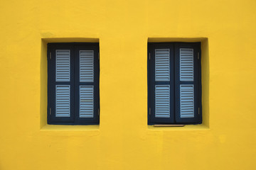 Beautiful window on yellow wall