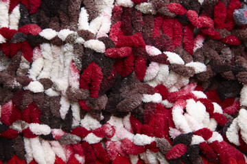 A full page of red and white chunky knit fabric background texture