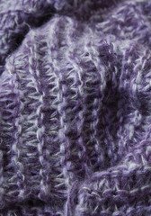 A full page of soft purple knitted sweater background texture