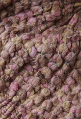 A full page of pink chunky knit fabric background texture