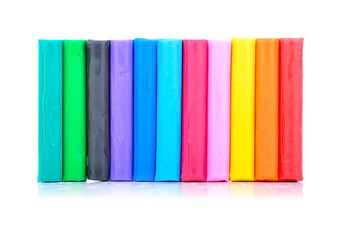 close up of colorful playdough on white background