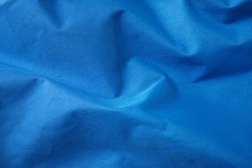 A full page of blue canvas material background texture