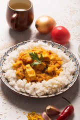 Chicken curry with rice and ingredients