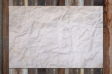 White blank crumpled paper on grunge wooden table