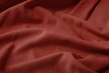 A full page of soft red shirt fabric background texture