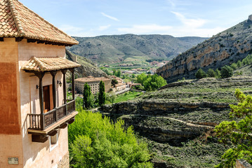 sight of a balcony in forefront of the picturesque medieval people of Albarracin in the province of Teruel, Aragon, Spain