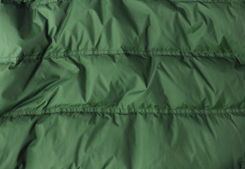 A full page of bright green sleeping bag background texture