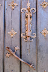door knocker and medieval handhold in an apuerta in the Albarracin town in the province of Teruel, Aragon, Spain
