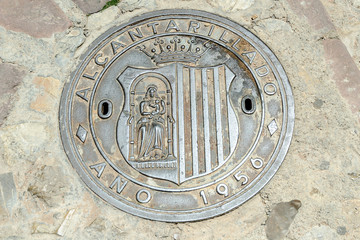 lid of sewer of the picturesque medieval people of Albarracin in the province of Teruel, Aragon, Spain