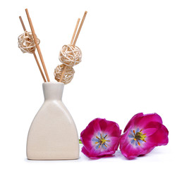 Air freshener with wooden aroma sticks and tulip flowers isolated on white background