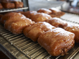 Freshly Made Donuts Getting Ready for Sale