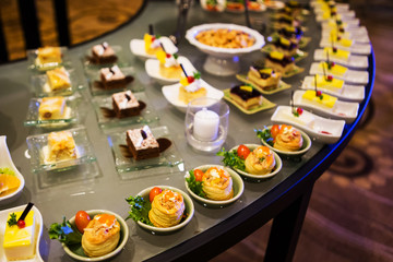Close-up view of dessert buffet with delicious sweet bakery and