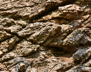 Rock texture.Dark brown solid rock texture with crack lines