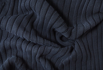 A full page of navy blue knitwear fabric background texture