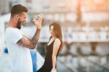 couple posing against the backdrop of the city