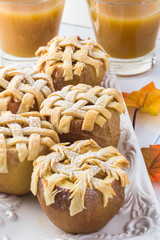 Fresh baked apple pie in apple and apple cider.