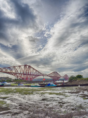 Boats moored in front of the Forth Rail Bridge